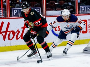 Ottawa Senators right wing Evgenii Dadonov (63) eludes then check of Edmonton Oilers defenseman William Lagesson (84) in first period NHL action at the Canadian Tire Centre.