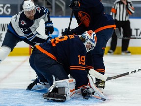 Edmonton Oilers goaltender Mikko Koskinen (19) makes a save on the Winnipeg Jets during second period NHL action at Rogers Place in Edmonton, on Monday, Feb. 15, 2021.
