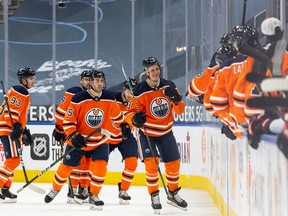 Edmonton Oilers' Jesse Puljujarvi (13) celebrates a second goal on Ottawa Senators' goaltender Marcus Hogberg (1) during second period NHL action at Rogers Place in Edmonton, on Tuesday, Feb. 2, 2021.