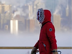 A woman takes a stroll in Edmonton on Sunday February 7, 2021. An extreme cold warning was issued on for the Edmonton region with temperatures plunging to -35C degrees and wind chill values between -40C and -55C degrees.