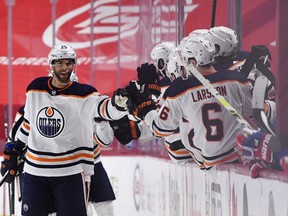 Edmonton Oilers defenseman Darnell Nurse (25) reacts with teammates after scoring a goal against the Montreal Canadiens during the second period at the Bell Centre on Feb. 11, 2021.
