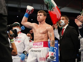 This handout photo released by Matchroom shows Saul "Canelo" Alvarez after winning his WBA, WBC and Ring Magazine super middleweight championship bout against Avni Yildirim at the Hard Rock Stadium in Miami Gardens, Fla., Feb. 27, 2021.