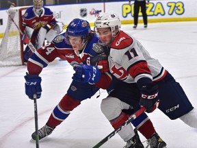 Edmonton Oil Kings Logan Dowhaniuk (24) Lethbridge Hurricanes Dino Kambeitz (11) fight for the puck during WHL action at Rogers Place in Edmonton, February 26, 2021.