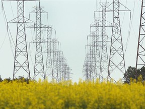 Power transmission lines are shown on the eastern edge of Calgary on Wednesday, July 18, 2018.