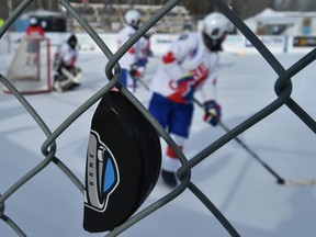 It's so cold that pucks have been shattering at the World's Longest Hockey Game, which is over the halfway point in raising funds for cancer research, out at Saikers Acres near Sherwood Park, Feb. 10, 2021.