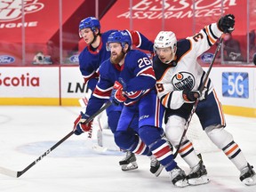 Jeff Petry (26) of the Montreal Canadiens skates against Alex Chiasson (39) of the Edmonton Oilers at the Bell Centre on Feb. 11, 2021, in Montreal, Canada.