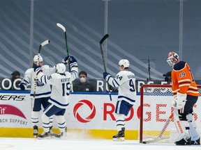 The Toronto Maple Leafs’ William Nylander (88) celebrates a goal with teammates on Edmonton Oilers goaltender Mikko Koskinen (19) at Rogers Place in Edmonton on Monday, March 1, 2021.