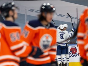 Toronto Maple Leafs’ Ilya Mikheyev (65) celebrates a goal with teammates against Edmonton Oilers goaltender Mike Smith at Rogers Place in Edmonton on Wednesday, March 3, 2021.