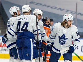 Toronto Maple Leafs’ William Nylander (88) celebrates a goal on Edmonton Oilers’ goaltender Mike Smith (41) with teammates at Rogers Place in Edmonton on Wednesday, March 3, 2021.