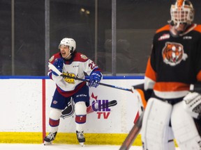 Edmonton Oil Kings’ Jalen Luypen celebrates a short-handed goal on Medicine Hat Tigers goaltender Garin Bjorklund (33) at the Downtown Community Rink in Edmonton on March 5, 2021.