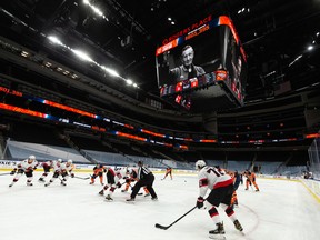 Walter Gretzky waves on the big screen as the Edmonton Oilers 50-50 raffle for Edmonton’s Food Bank is dedicated to Wayne Gretzky’s father, seen during an Edmonton Oilers and Ottawa Senators NHL game at Rogers Place in Edmonton, on Wednesday, March 10, 2021.