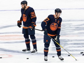 Edmonton Oilers Leon Draisaitl (29) and Connor McDavid (97) warm up before an NHL game against the Winnipeg Jets at Rogers Place in Edmonton on Saturday, March 20, 2021.
