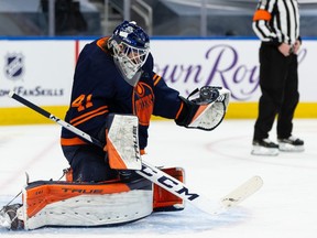 Edmonton Oilers goaltender Mike Smith (41) stops a Winnipeg Jets shot during second period NHL action at Rogers Place in Edmonton, on Saturday, March 20, 2021.