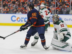 Edmonton Oilers forward Kailer Yamamoto (56) deflects a shot against Minnesota Wild goaltender Alex Stalock (32) at Rogers Place on Feb 21, 2020.