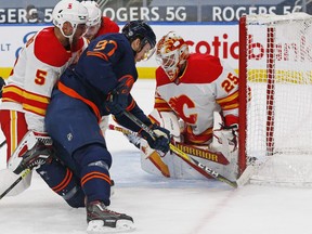 Edmonton Oilers forward Connor McDavid (97) shoots the puck against Calgary Flames goaltender Jacob Markstrom (25) during the third period at Rogers Place on Mar. 6, 2021.