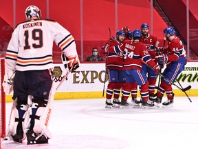 Montreal Canadiens left wing Tomas Tatar (90) celebrates his goal against Edmonton Oilers goaltender Mikko Koskinen (19) with teammates during the second period at Bell Centre on Mar. 30, 2021.