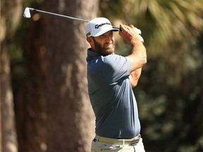 Dustin Johnson plays his shot from the tee during the second round of THE PLAYERS Championship on THE PLAYERS Stadium Course at TPC Sawgrass on March 12, 2021 in Ponte Vedra Beach, Florida.