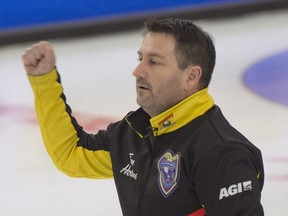 New Brunswick skip James Grattan pumps his fist after a win at the 2021 Tim Hortons Brier in Calgary.