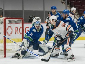 Vancouver Canucks goalie Thatcher Demko (35) makes a save on Edmonton Oilers forward Kailer Yamamoto (56) at Rogers Arena on March 13, 2021.