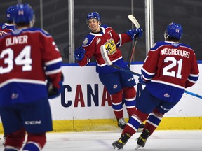 Edmonton Oil Kings forward Dylan Guenther (11) celebrates his goal against the Lethbridge Hurricanes at Rogers Place in Edmonton on Feb. 26, 2021.