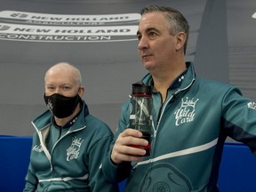 Wayne Middaugh (right) and Glenn Howard of Wild Card 3 won their opening game at the Tim Hortons Brier on March 6, 2021.
