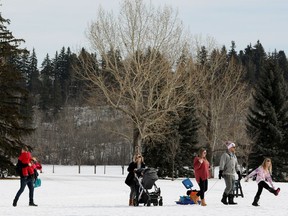 Families enjoy the warm weather in Edmonton's Hawrelak Park, Wednesday March 3, 2021.
