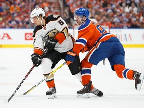 Connor McDavid (97) of the Edmonton Oilers battles against Rickard Rakell (67) of the Anaheim Ducks in Game 3 of the Western Conference second round during the 2017 NHL Stanley Cup Playoffs at Rogers Place on April 30, 2017, in Edmonton.
