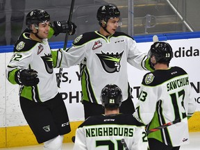 Edmonton Oil Kings forward Dylan Guenther (top) celebrates his goal with teammates against the Red Deer Rebels at Rogers Place in Edmonton on Feb. 7, 2020.