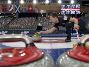 The flags of Canada's major challengers at the world men's curling championship -- from left, Norway, RCF, Scotland, Sweden, Switzerland, and the U.S. -- loom over the shoulder of Canadian skip Brendan Bottcher.
