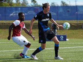 FC Edmonton striker Easton Ongaro, right, holds off Valour FC midfielder Raphael Ohin at the Canadian Premier League Island Games tournament in Charlottetown, P.E.I., on Aug. 29, 2020.