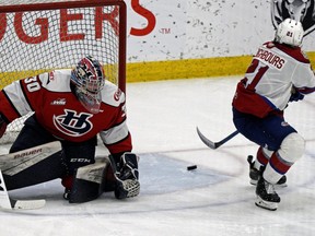 Edmonton Oil Kings Jake Neighbours (right) scores on a penalty shot on Lethbridge Hurricanes goalie Bryan Thomson during WHL hockey game action in Edmonton on Saturday April 17, 2021.