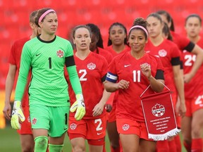 Canada players walk out to face England at bet365 Stadium in Stoke-on-Trent, England on April 13, 2021.