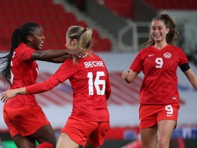 Canada's Nichelle Prince celebrates scoring their second goal with Janine Beckie (16) and Jordyn Huitema (9) against England at bet365 Stadium in Stoke-on-Trent, England, on April 13, 2021.