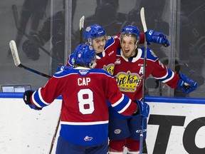 Edmonton Oil Kings forward Jake Neighbours (right) celebrates a goal with Josh Williams and Ethan Cap in a three-game series against the Medicine Hat Tigers, which wrapped up Sunday, April 25, 2021, in Edmonton.