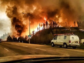 Wildfires encroach on Highway 63 near Fort McMurray on May 3, 2016.