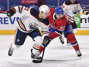 Dominik Kahun (21) of the Edmonton Oilers skates against Artturi Lehkonen (62) of the Montreal Canadiens at Bell Centre on May 12, 2021, in Montreal.