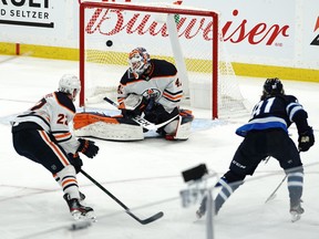 Kyle Connor #81 of the Winnipeg Jets scores the game-winning goal against Mike Smith #41 of the Edmonton Oilers during the overtime period in Game Four of the First Round of the 2021 Stanley Cup Playoffs on May 24, 2021 at Bell MTS Place in Winnipeg.