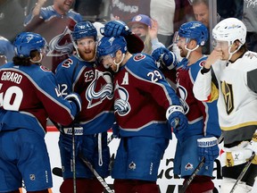 Nathan MacKinnon (29) of the Colorado Avalanche celebrates with  Samuel Girard (49), Gabriel Landeskog (92) and Joonas Donskoi (72) after scoring against the Vegas Golden Knights in Game 1 of their second round 2021 Stanley Cup playoff series at Ball Arena on May 30, 2021.