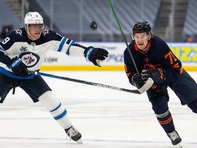 Edmonton Oilers forward Ryan McLeod (71) battles the Winnipeg Jets’ Andrew Copp (9) during Game 2 of their NHL North Division playoff series at Rogers Place in Edmonton on Friday, May 21, 2021.
