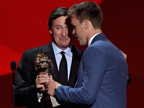 Connor McDavid of the Edmonton Oilers talks with Wayne Gretzky after winning the Hart Memorial Trophy during the 2017 NHL Awards and Expansion Draft at T-Mobile Arena on June 21, 2017, in Las Vegas, Nevada.