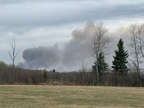 A wildfire burns in Parkland County near the village of Tomahawk on May 7, 2021.