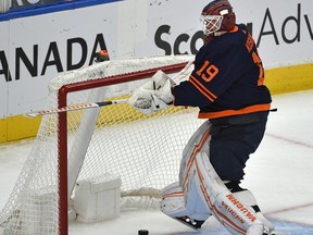 Edmonton Oilers goalie Mikko Koskinen (19) breaks his stick after allowing the fourth goal in under 13 minutes of play against the Vancouver Canucks at Rogers Place on May 6, 2021. He was taken out of the game after this.