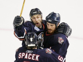 Edmonton Oilers Fernando Pisani (right), Ryan Smyth and Jaroslav Spacek celebrate after Pisani scored against the Carolina Hurricanes in Game 6 of the Stanley Cup Finals at Rexall Place in Edmonton on June 17, 2006. Edmonton Sun/QMI Agency