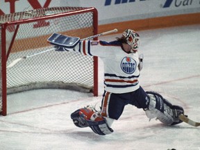 Edmonton Oilers goalie Bill Ranford makes a point-blank toe save off of the Winnipeg Jets' Moe Mantha during Game 2 of the Smythe Division semifinals at Northlands Coliseum in Edmonton on April 6, 1990. The Oilers went on to win the series in seven games and then beat the Boston Bruins in five games to win their fifth Stanley Cup.