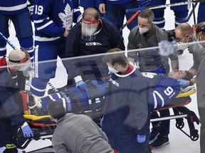 Maple Leafs captain John Tavares is stretchered off the ice in Game 1 versus Montreal on Thursday. THE CANADIAN PRESS