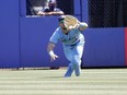 Toronto Blue Jays center fielder Randal Grichuk catches a fly ball during the eighth inning against the Tampa Bay Rays at TD Ballpark.