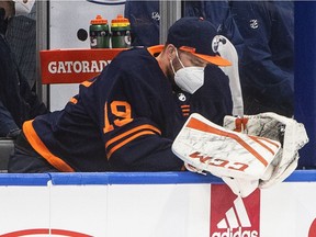 Edmonton Oilers goalie Mikko Koskinen (19) sits on the bench after being pulled for letting in 4 goals against the Vancouver Canucks during second period NHL action in Edmonton on Thursday, May 6, 2021.