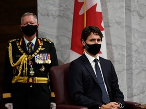 Then Chief of Defence Staff Jonathan Vance and Prime Minister Justin Trudeau listen to Canada's Governor General Julie Payette delivering the throne speech in the Senate chamber in Ottawa, Ontario, Canada on Sept. 23, 2020.