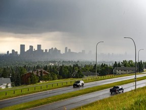 FILE - Downtown Calgary is seen from Nose Hill Park moments before it was taken over by stormy clouds on Thursday, July 23, 2020.