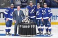 NHL deputy commissioner Bill Daly presents Alex Killorn, Ryan McDonagh, Victor Hedman and Steven Stamkos of the Tampa Bay Lightning with the Prince of Wales Trophy.